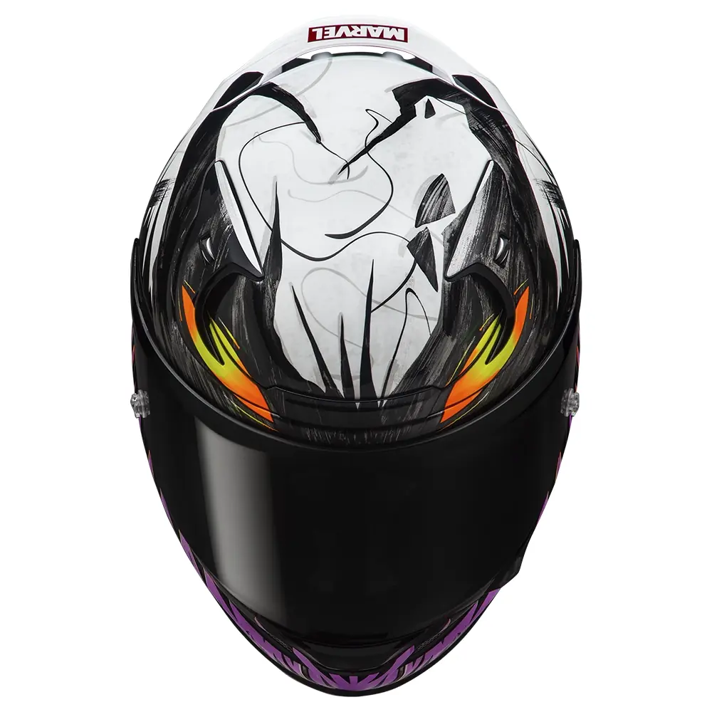 Casco integral de motocicleta con diseño de Venom de Marvel, colores blanco, negro, amarillo y morado, vista frontal superior.
