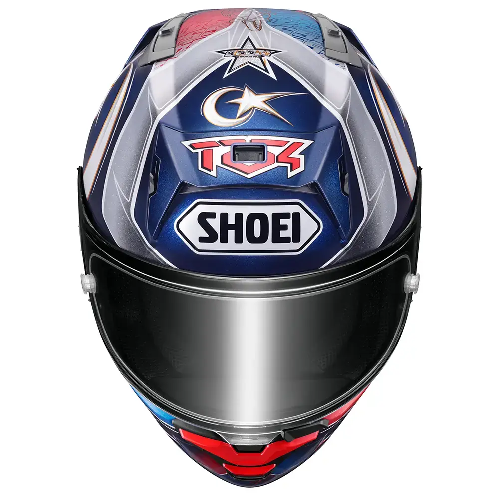 Vista frontal de casco de motocicleta SHOEI modelo TC-4, colores azul, rojo y blanco, con visera oscura y gráficos de estrella y luna.